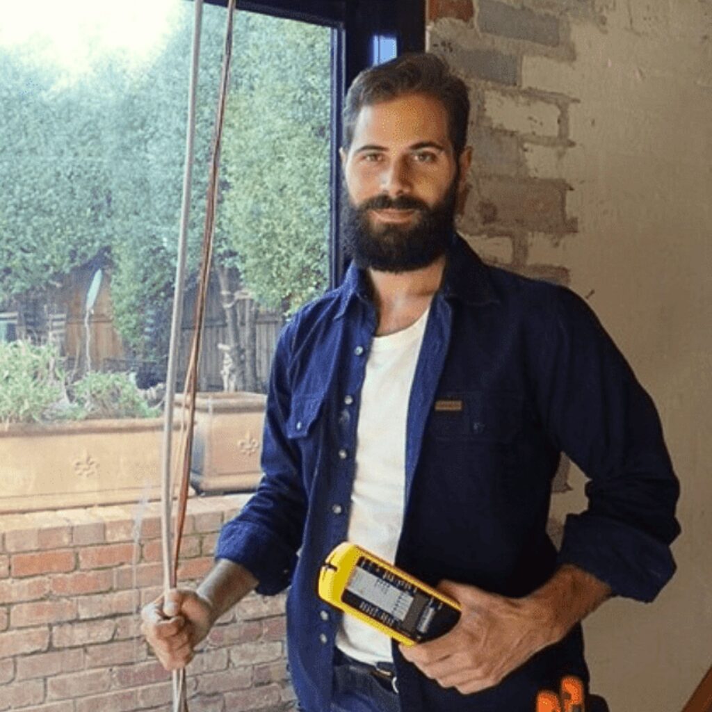 Marco Simeoni from Spectral Design conducting EMF measurement in a Melbourne home using professional meters.